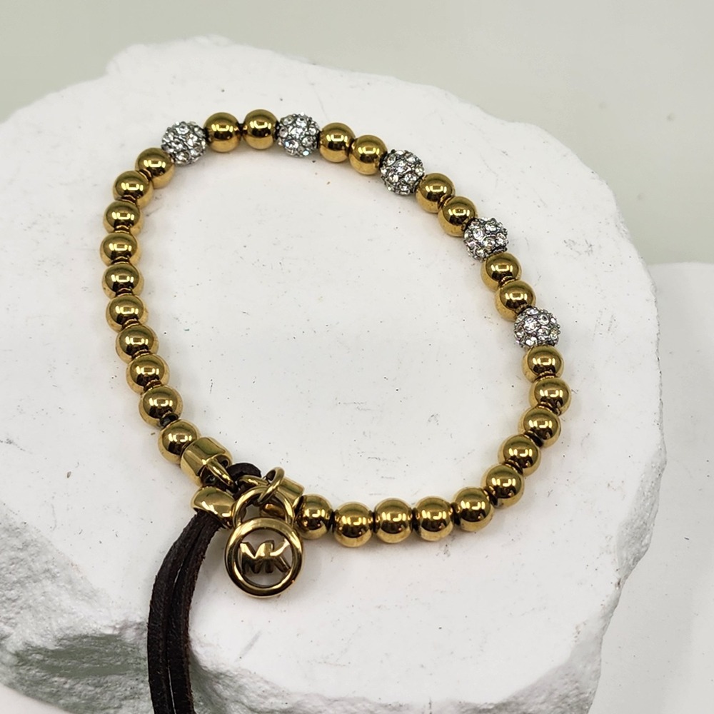 Michael Kors Gold Tone Beaded Rhinestone Logo Tassel Stretch Bracelet Statement